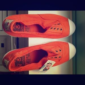 Brand new orange slip on sneakers